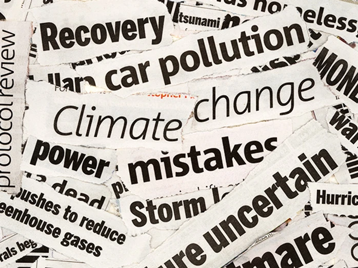 Newspaper headlines highlighting the urgency of the climate crisis