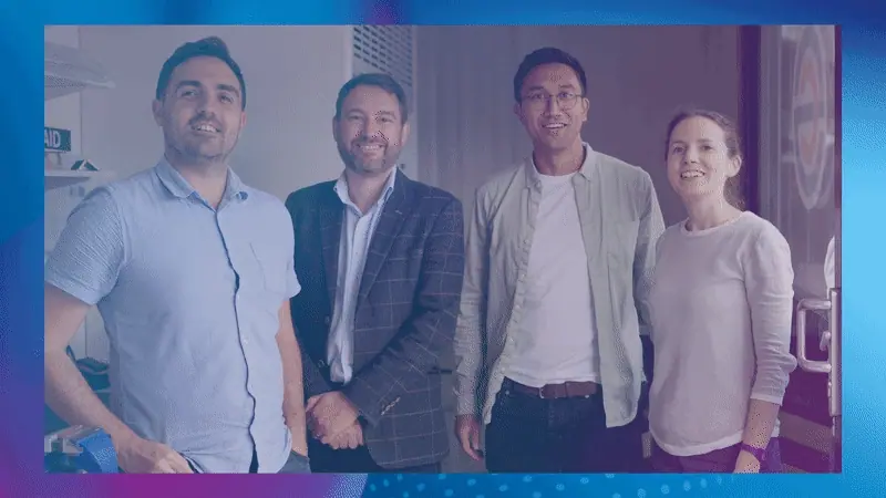 Four members of the Supercritical team pose together, then cheer